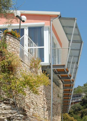 a staircase leading up to a house with a balcony at Hotel Cristallo in Lerici