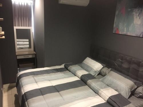 Postel nebo postele na pokoji v ubytování Cinere Bellevue Suites