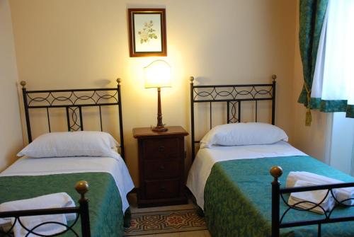 Giường trong phòng chung tại Hotel del Centro