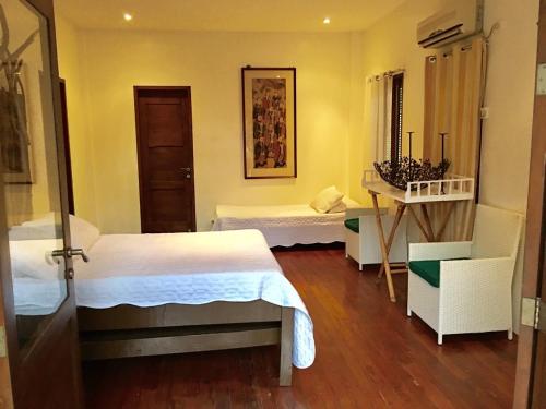 Una cama o camas en una habitación de Dapitan Beach Villa