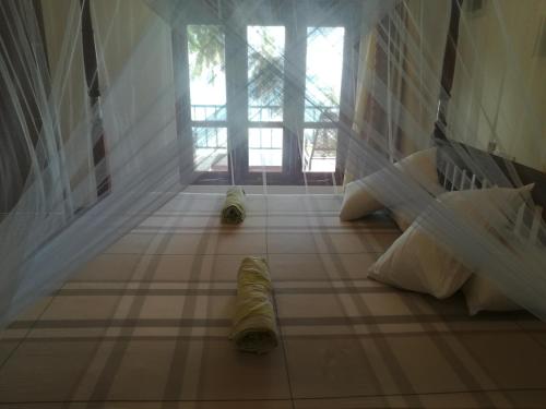 Ein Bett oder Betten in einem Zimmer der Unterkunft Star Beach Hotel