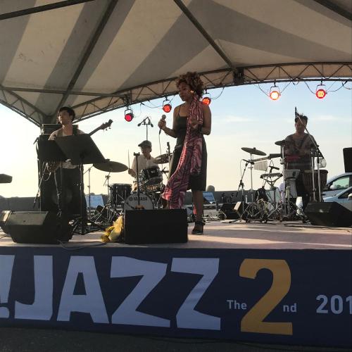 a group of people on a stage at a concert at Kizuna no Ie in Uozu