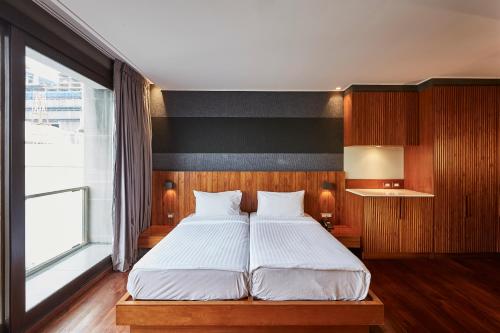 Katil atau katil-katil dalam bilik di LUXX Langsuan Hotel - SHA Plus