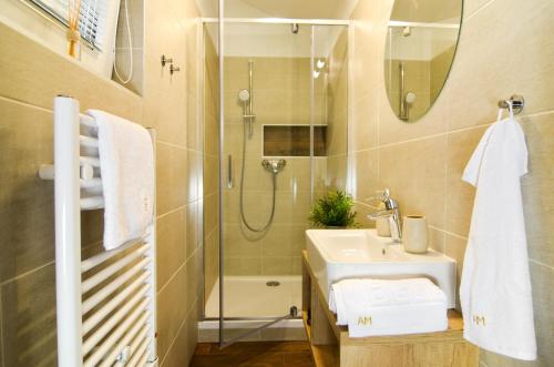 a bathroom with a sink and a shower at Apartmány Milovice in Milovice