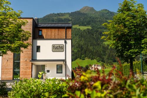 a hotel with a view of a mountain at Fuchs Apartments - inklusive Eintritt in die Alpentherme Gastein in Bad Hofgastein