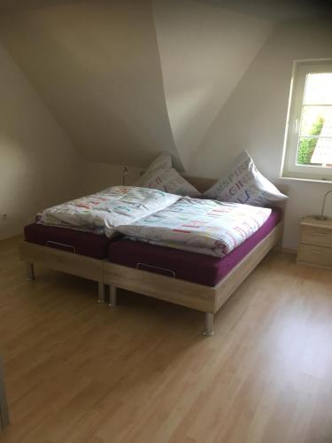 a bedroom with a bed in a attic at FeWo Haase in Westerstede