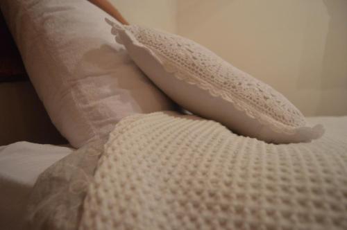two pillows sitting on top of a bed at Gate Away B&B Units - המקום באל רום in El-Rom