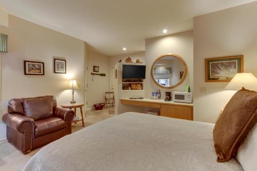 a bedroom with a bed and a chair and a desk at Seclusion in Century West in Bend