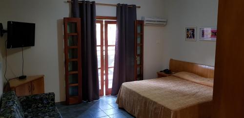 Säng eller sängar i ett rum på Ilha Flat Apto 3207