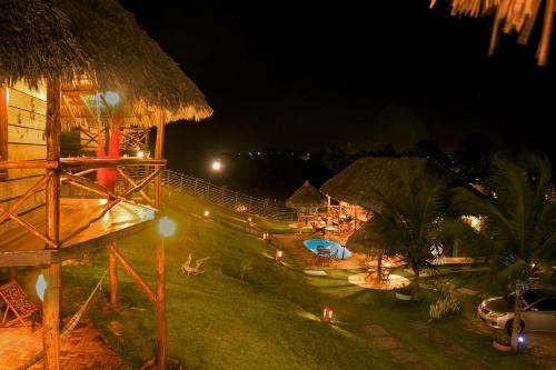a view of a resort at night at Pousada Theodora in Macapá