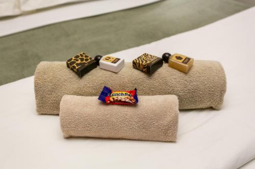 a group of five pieces of food on top of towels at Royl Court Guesthouse in Kimberley