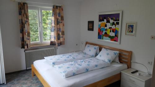 Ένα ή περισσότερα κρεβάτια σε δωμάτιο στο Haus Olympia