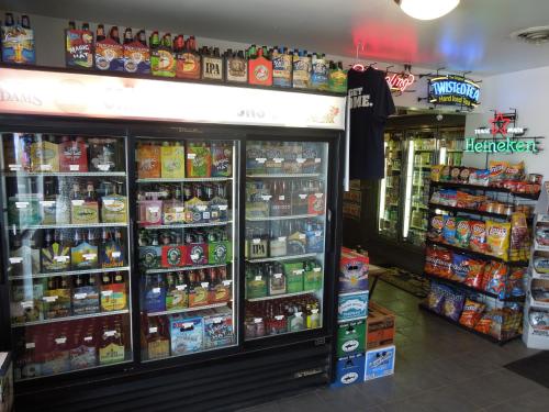 a store with a large display of food and drinks at Nittany Budget Motel in State College