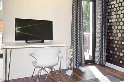 Μια τηλεόραση ή/και κέντρο ψυχαγωγίας στο Eco Smart Apartments Erlangen