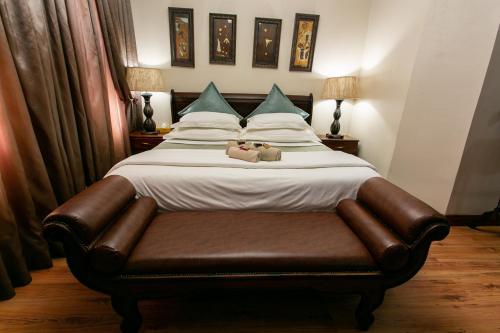 a bed with two teddy bears sitting on it at Royl Court Guesthouse in Kimberley
