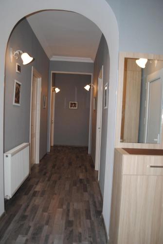 an empty hallway with an archway in a house at Hotel Terrace Rabath in Akhaltsikhe