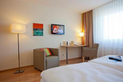 Hotel am Markt Garni - Aegidienbergにあるベッド