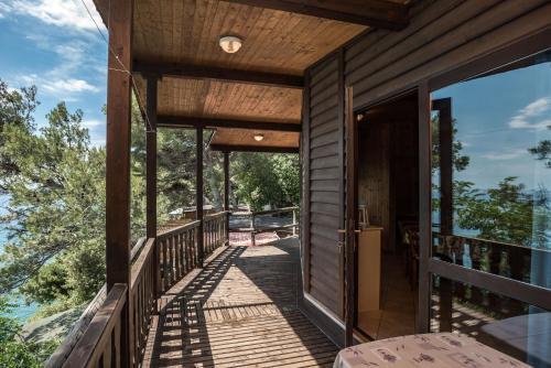 a house with a wrap around deck with a view at Villaggio Smeraldo in Moneglia
