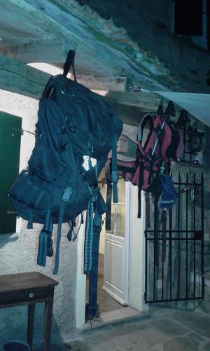 a bunch of bags hanging from the door of a building at Casa Emilia in Stazzema