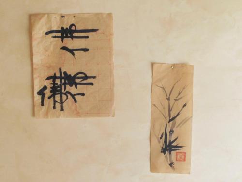 two chinese drawings of birds and a tree on a wall at Oasi Galbusera Bianca in Rovagnate