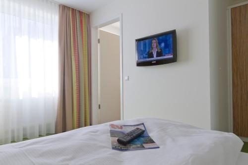 Hotel am Markt Garni - Aegidienbergにあるベッド