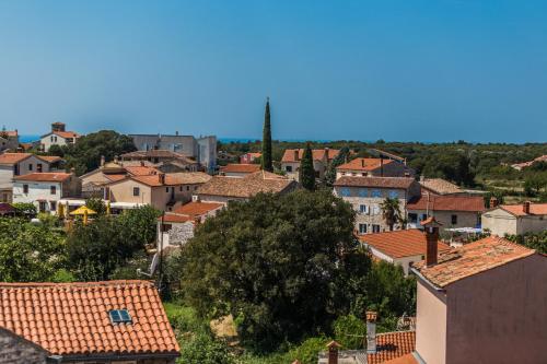 a view of a town with orange roofs at Guest House Robert i Mirna in Bale