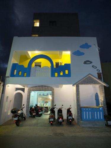 a group of motorcycles parked in front of a building at Lang Jiao Ya She Homestay in Hengchun