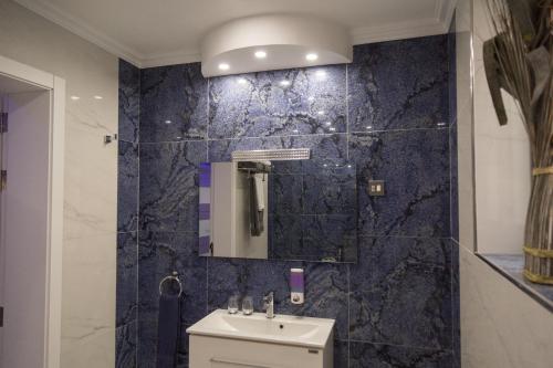 A bathroom at Azure Apartment