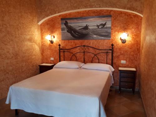 Postel nebo postele na pokoji v ubytování B&B Da Sabrina
