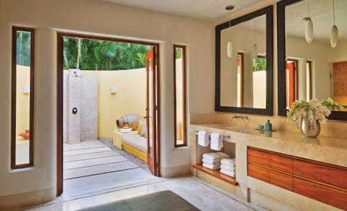 a bathroom with a sink and a toilet and a shower at Four Seasons Resort Punta Mita in Punta Mita