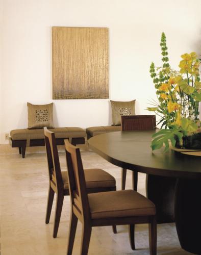 a dining room with a table and chairs at Four Seasons Resort Punta Mita in Punta Mita