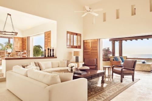 a living room with a white couch and a table at Four Seasons Resort Punta Mita in Punta Mita