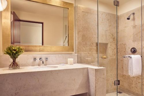 a bathroom with a sink and a mirror at Four Seasons Resort Punta Mita in Punta Mita