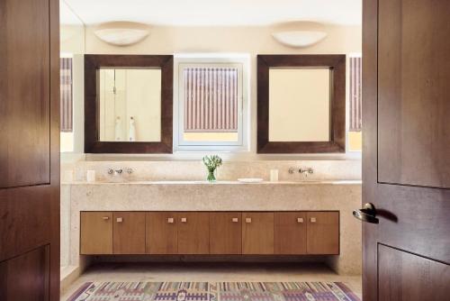 a bathroom with a sink and two windows at Four Seasons Resort Punta Mita in Punta Mita