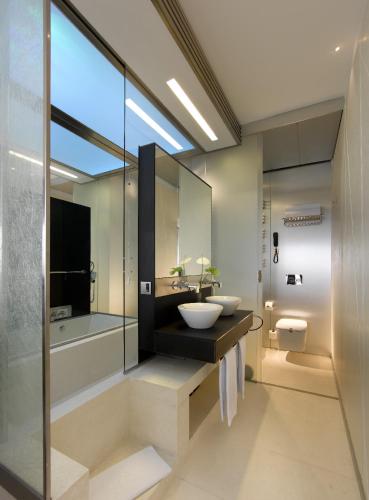 a bathroom with a sink and a mirror at Parador de Cádiz in Cádiz