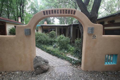 a sign for a garden with a sign that says derminationsein at Dreamcatcher B&B in Taos