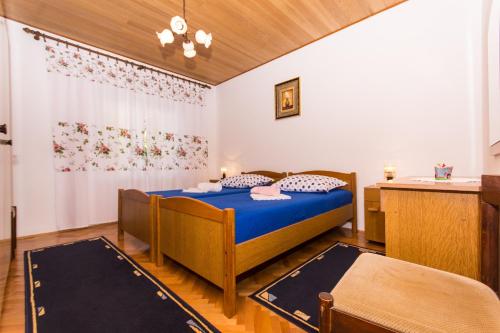 Postel nebo postele na pokoji v ubytování Apartman Maja