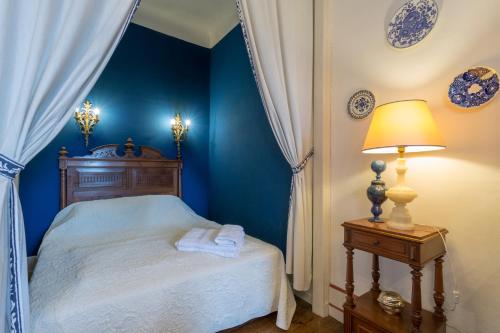 Ένα ή περισσότερα κρεβάτια σε δωμάτιο στο Chateau d'Estrac