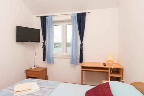 Postel nebo postele na pokoji v ubytování Apartments Vladimir