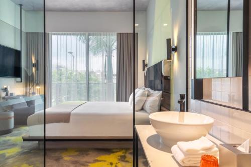 Postel nebo postele na pokoji v ubytování Hyde Suites Midtown Miami