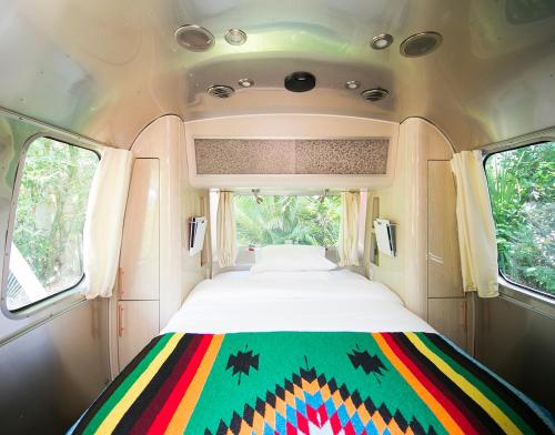 a bed in the back of a bus at Caravan Outpost in Ojai