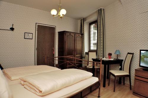 Postel nebo postele na pokoji v ubytování Hotel-Restaurant Moselblümchen