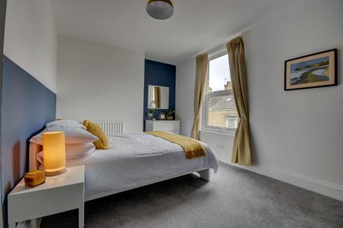 a bedroom with a bed and a window at 38 George Street in Whitby