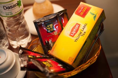 a basket filled with snacks on a table at Mountain Pearl Hotel in Cat Ba