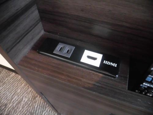 an electronic device on top of a wooden table at Via Inn Nagoya Station Tsubaki-cho in Nagoya