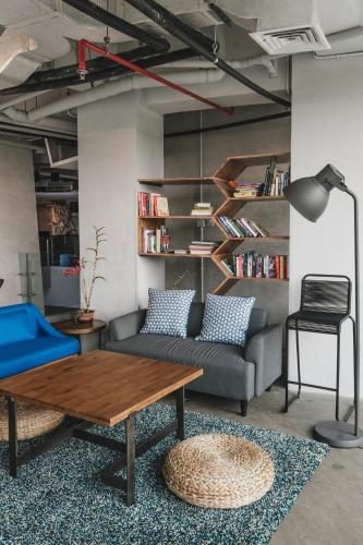 a living room with a couch and a table at Janevalla Bandung in Bandung