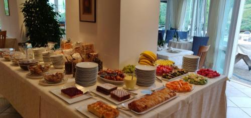 a table with many different types of food on it at Hotel Hanny in Bolzano