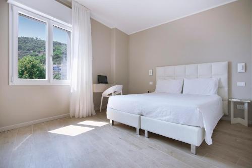 Postel nebo postele na pokoji v ubytování Residence Dolcemare