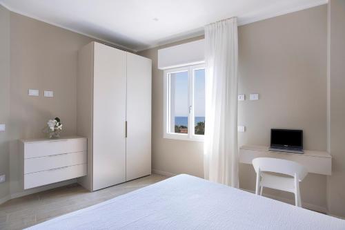 Postel nebo postele na pokoji v ubytování Residence Dolcemare