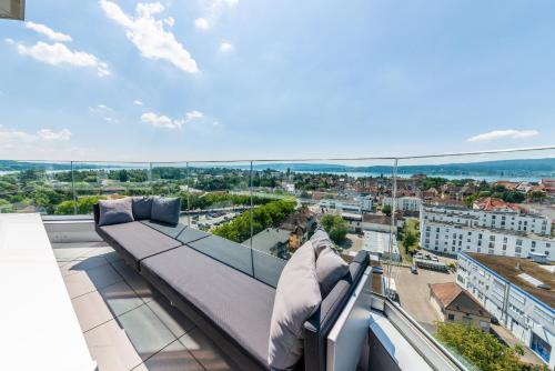 a view of a city from the balcony of a building at aquaTurm Hotel & Energie in Radolfzell am Bodensee